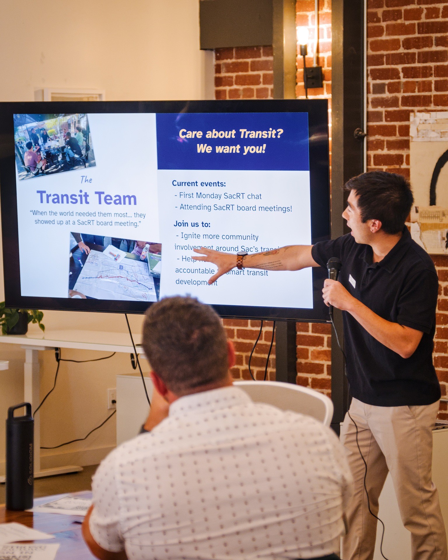 man taking a photo on a wharf